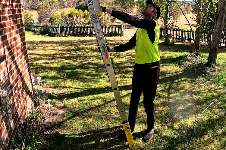 
Proficient gutter cleaning professional sets up their extension ladder in batemansbay.