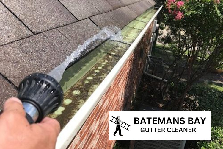 
Rinsing gutters to prevent clogging in Batemans Bay.
